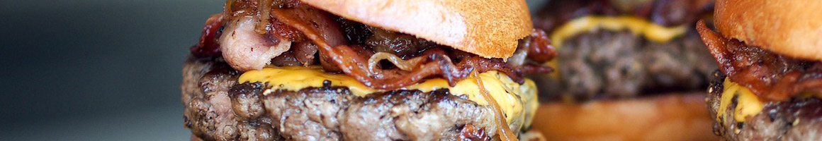 Eating Burger at Mooburger restaurant in Brooklyn, NY.